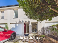 À Gennevilliers, maison familiale avec jardin, terrasse, garage et 4 chambres, à proximité du RER C et du tram T1.