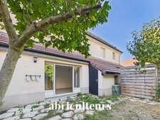 À Gennevilliers, maison familiale avec jardin, terrasse, garage et 4 chambres, à proximité du RER C et du tram T1.