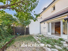 À Gennevilliers, maison familiale avec jardin, terrasse, garage et 4 chambres, à proximité du RER C et du tram T1.